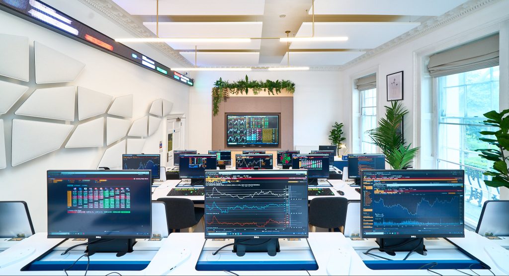 The state-of-the-art Bloomberg Lab at Guildhouse School London, featuring professional Bloomberg Terminals in a modern teaching environment.