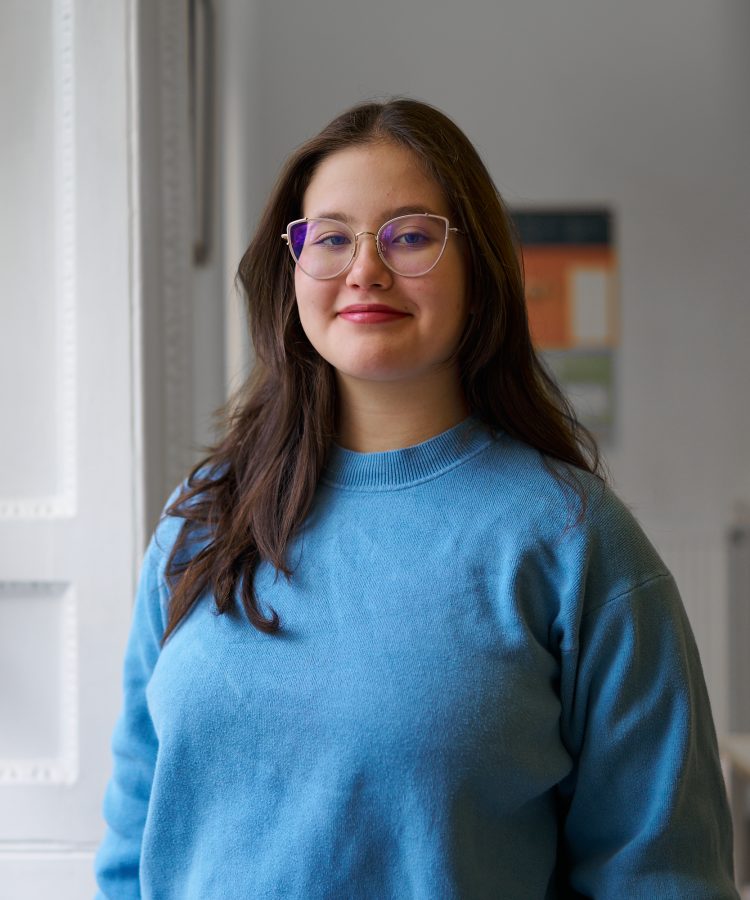 girl in blue shirt with glasses